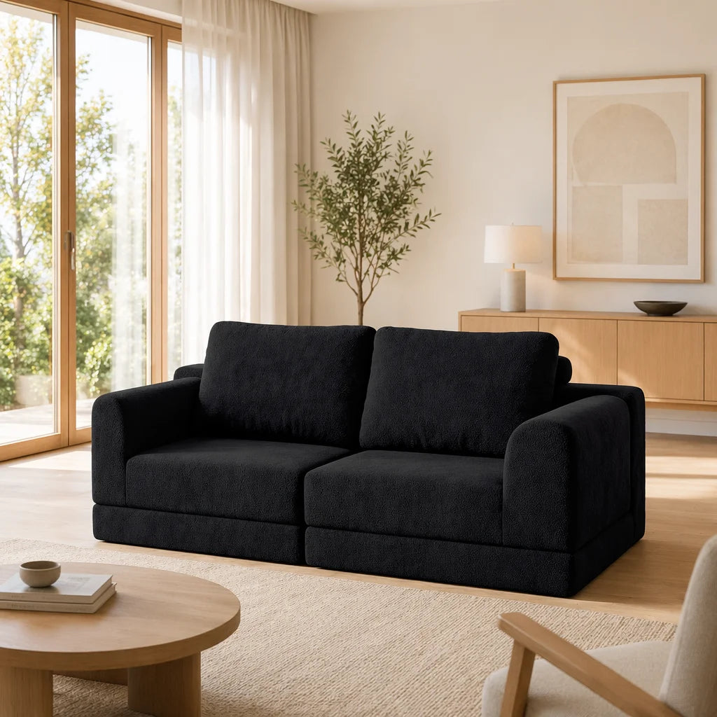 Canapé convertible modulable en tissu, noir, dans un salon