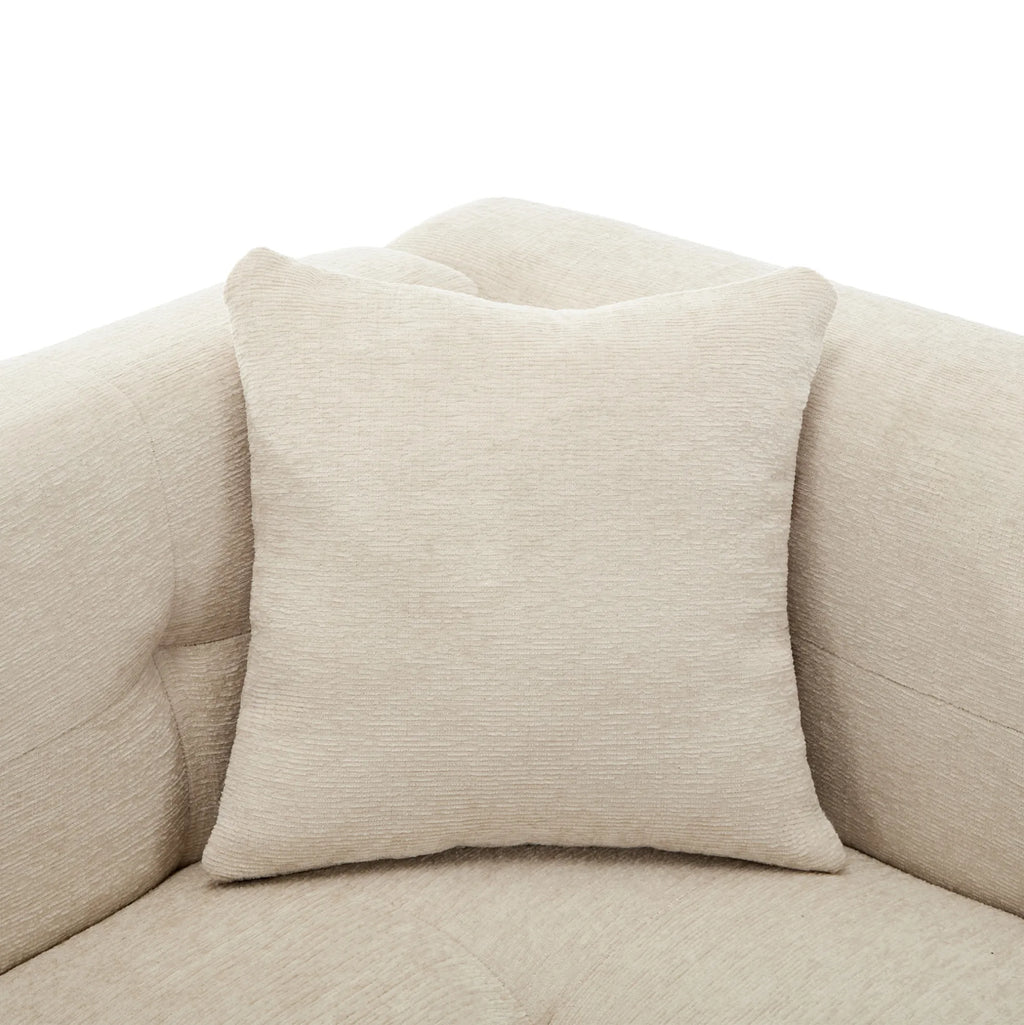Canapé d’angle modulable beige avec repose-pieds, détail du coussin
