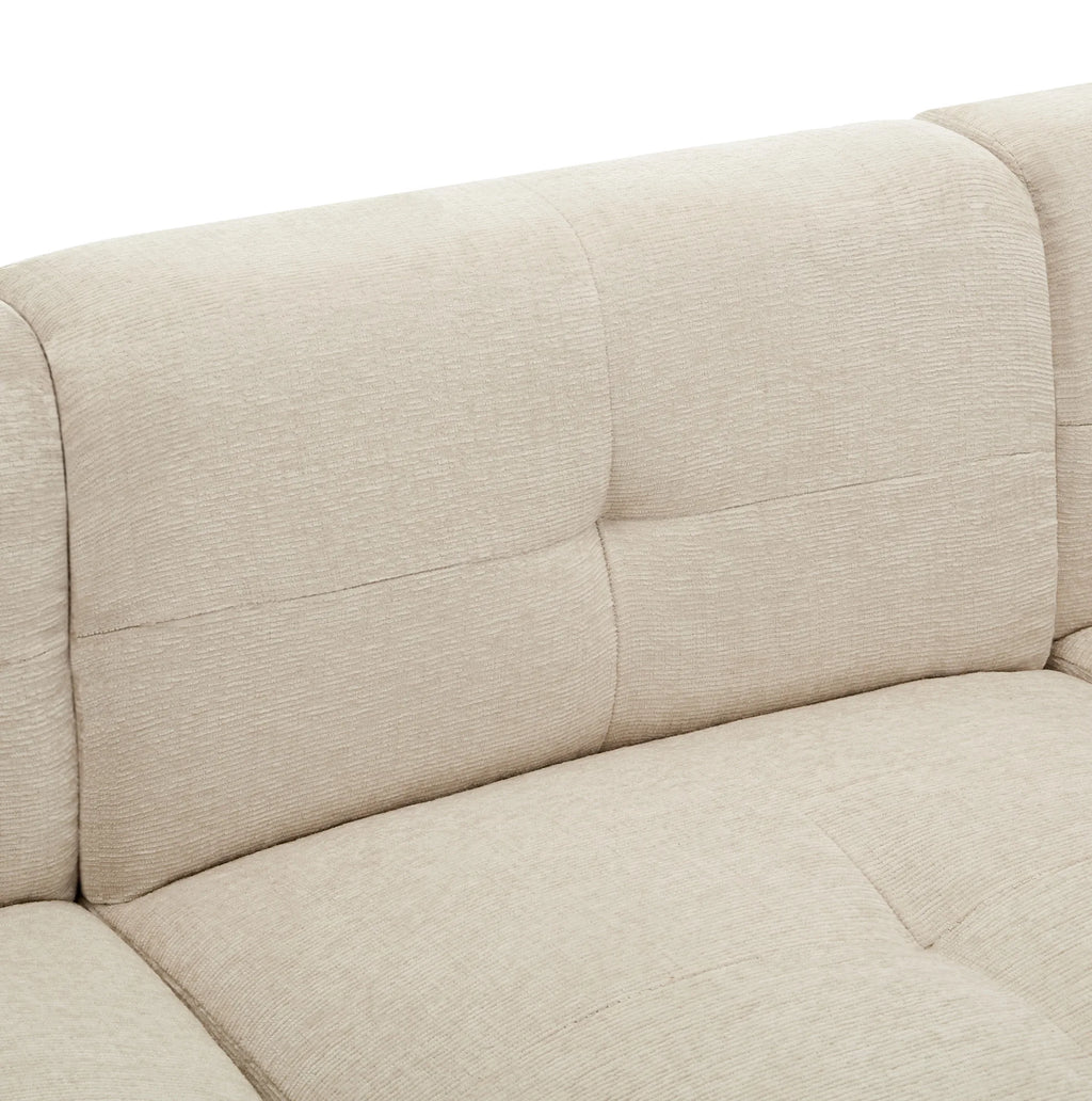 Canapé d’angle modulable beige avec repose-pieds, détail du dossier