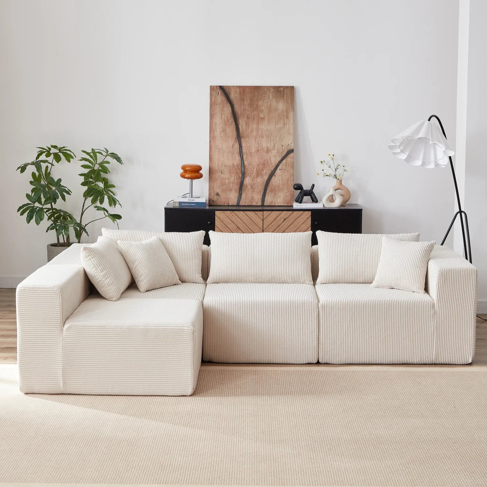 Canapé d’angle modulaire en tissu côtelé de 264 cm, beige, dans un salon