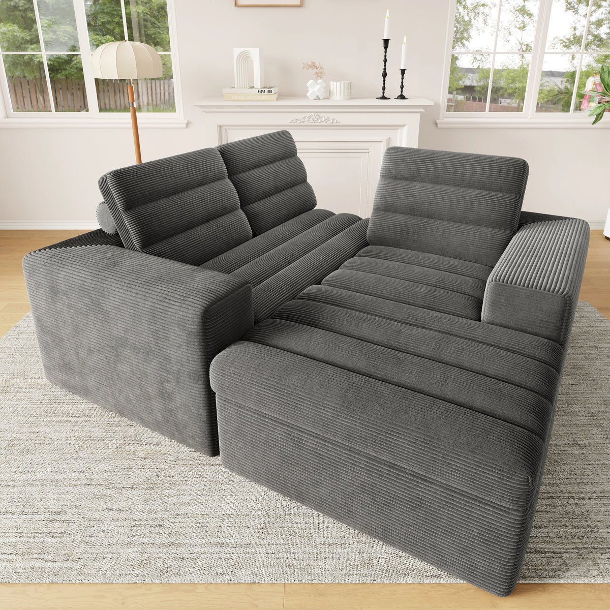 Canapé d’angle modulaire gris en velours côtelé avec pouf, modules disposés en angle