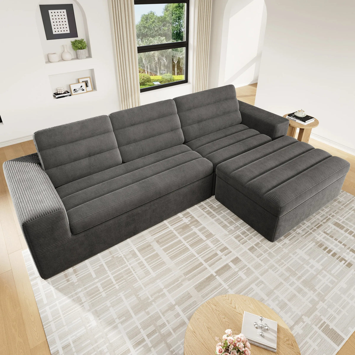 Canapé d’angle modulaire gris en velours côtelé avec pouf, vue de dessus en situation