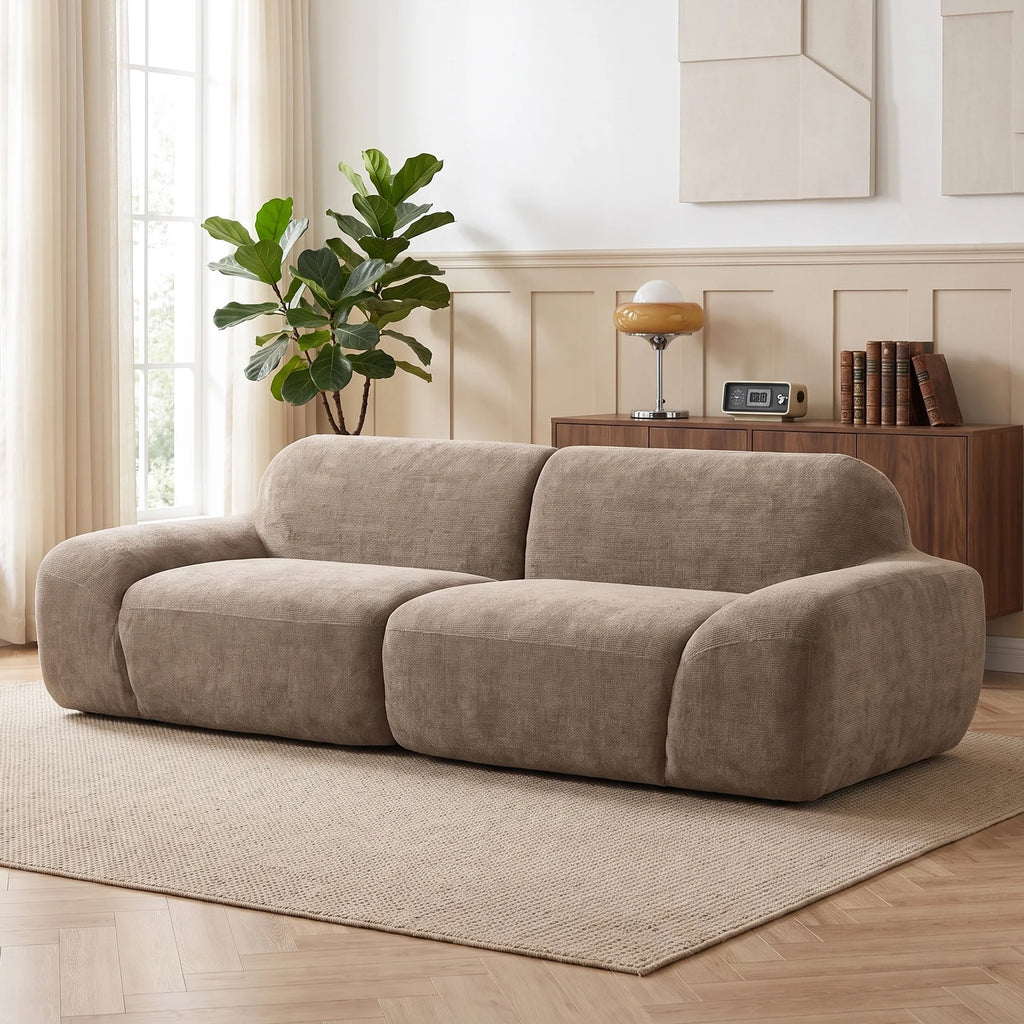 Canapé galet en chenille marron de 244 cm, vue de face dans un salon