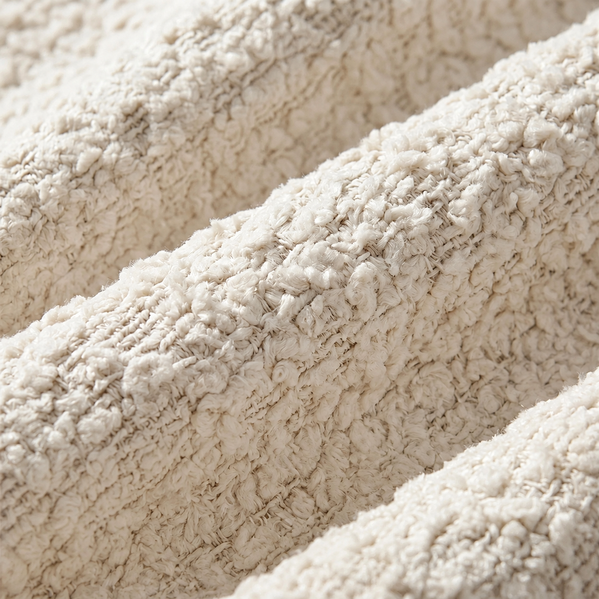 Détail du tissage en chenille crème du canapé incurvé de 188 cm