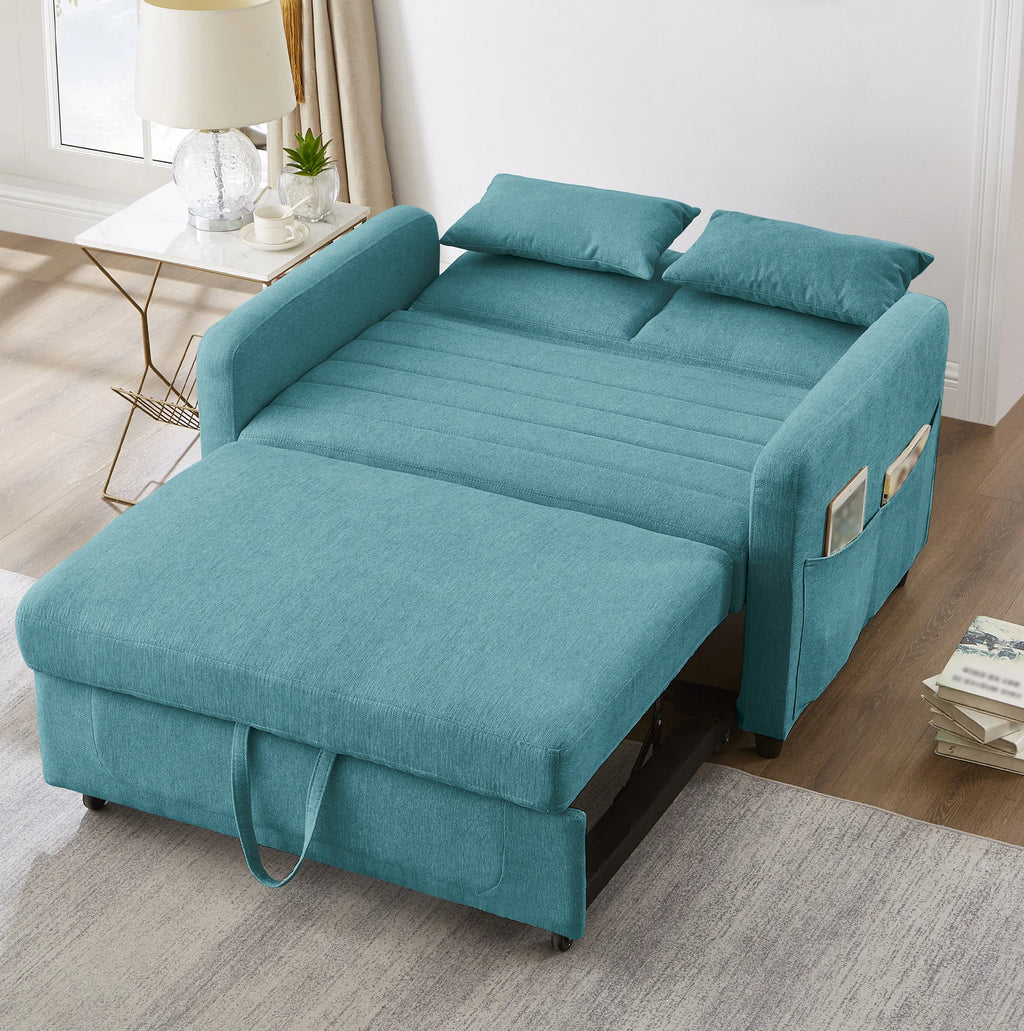 Canapé-lit bleu canard à couchage escamotable, déplié en couchage dans un salon