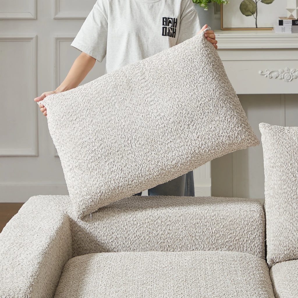 Canapé modulable beige en chenille avec méridienne, détail du coussin