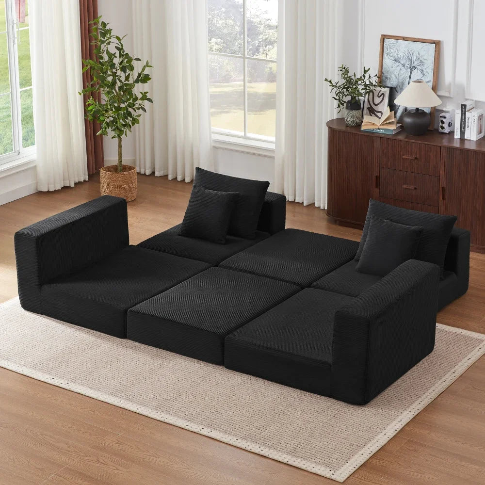 Canapé modulable convertible noir en velours côtelé, modules dépliés en couchage
