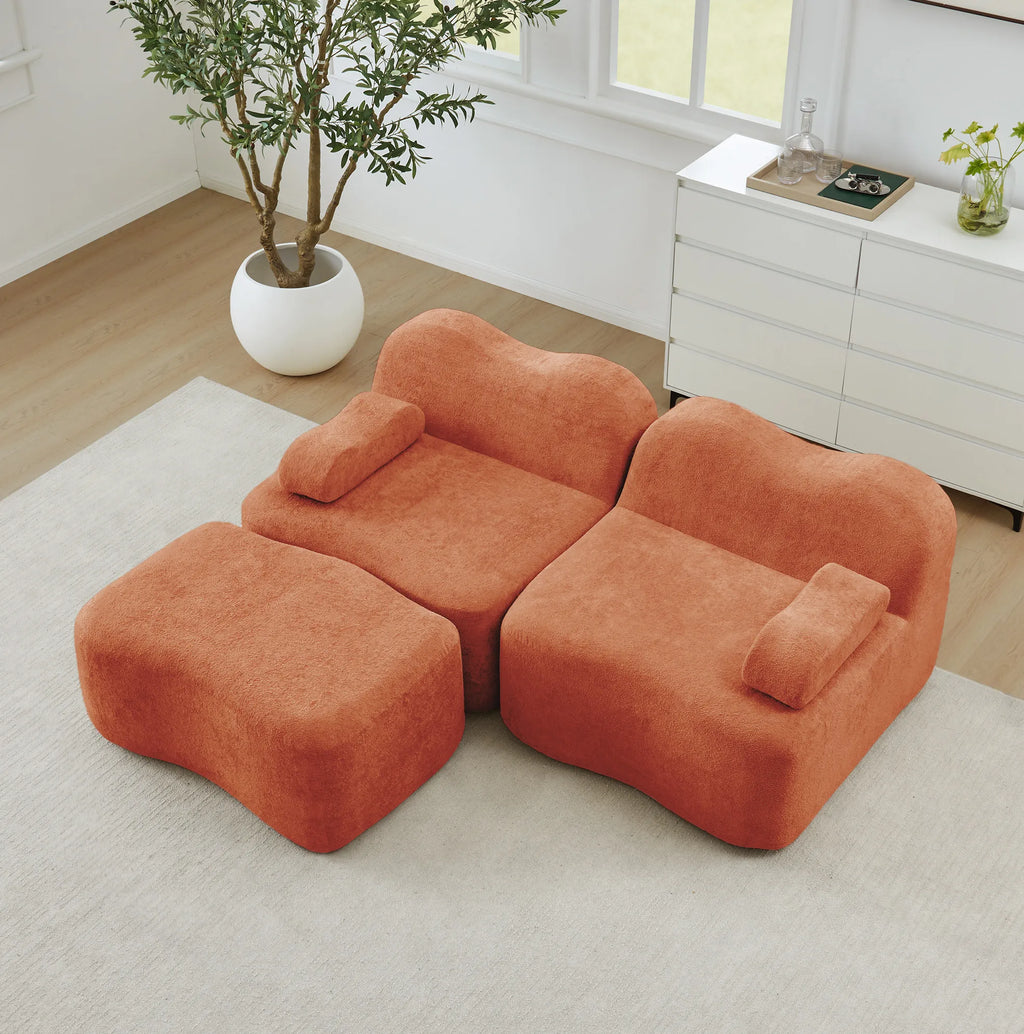Canapé modulable et pouf en tissu terracotta, vue de dessus dans un salon