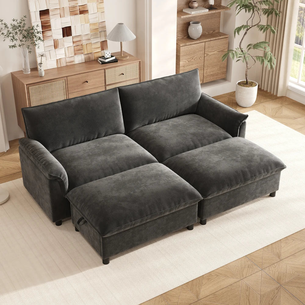 Canapé modulable noir avec repose-pieds, dans un salon