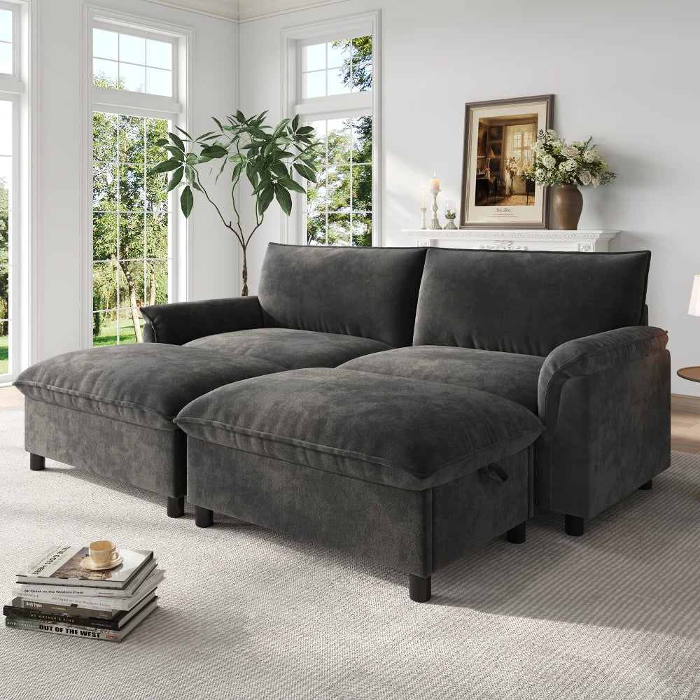 Canapé modulable noir avec repose-pieds, modules déplacés dans un salon