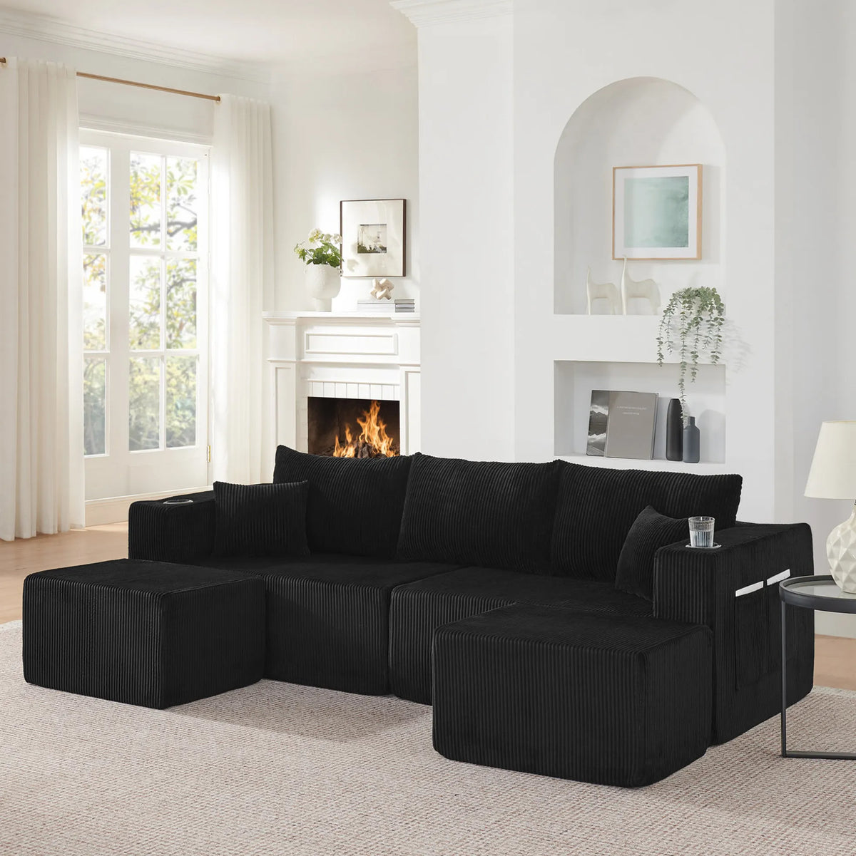 Canapé d'angle modulable en velours côtelé noir, poufs mobiles