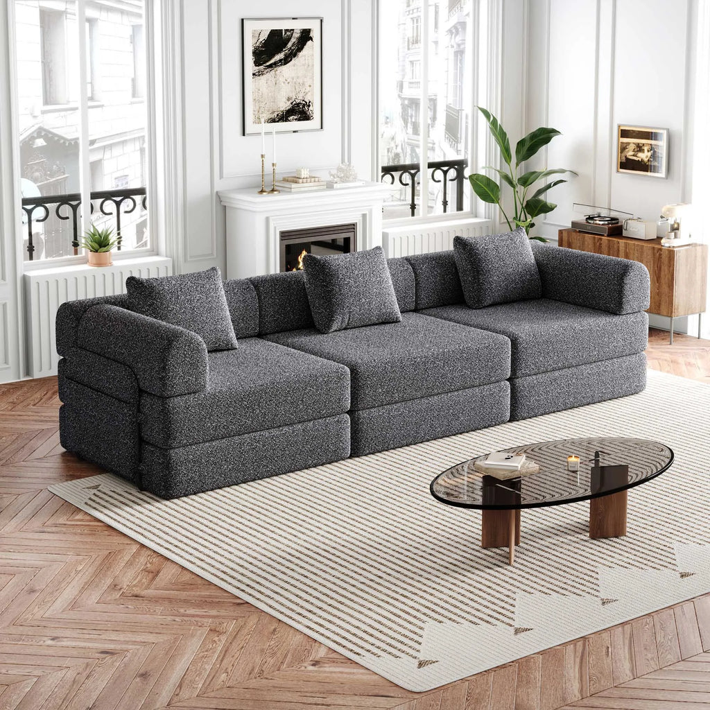 Canapé modulaire trois places en chenille, gris, dans un salon lumineux