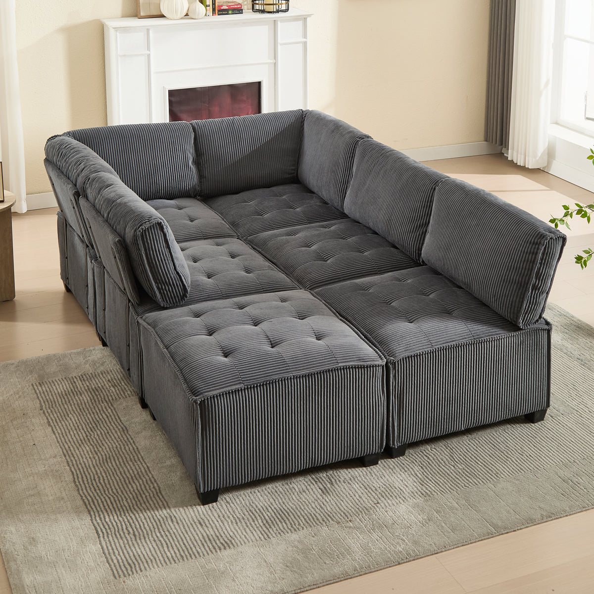 Canapé panoramique convertible en U, déplié en couchage dans un salon