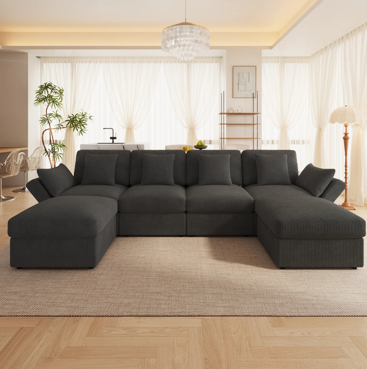 Canapé panoramique noir avec modules poufs, dans un salon