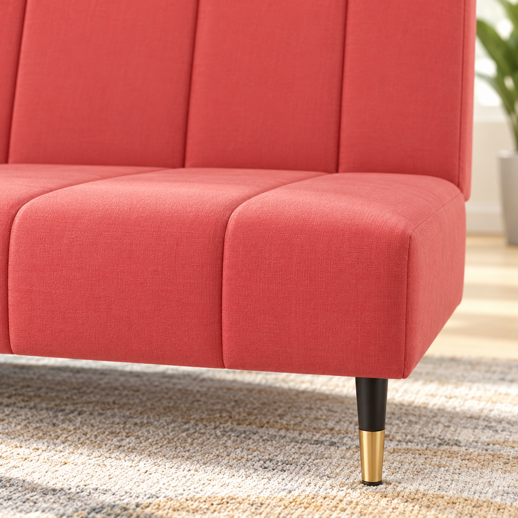 Canapé sans accoudoirs en velours rose, détail de l’assise et du pied noir et doré