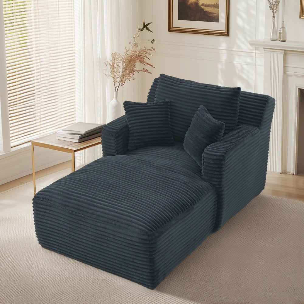 Chaise longue en velours côtelé à larges côtes, gris foncé, dans un salon