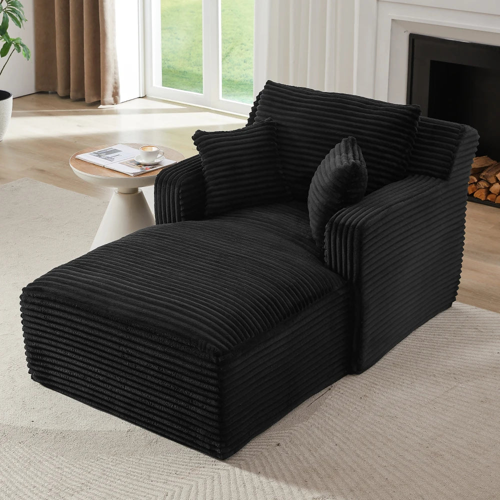Chaise longue en velours côtelé à larges côtes, noir, dans un salon