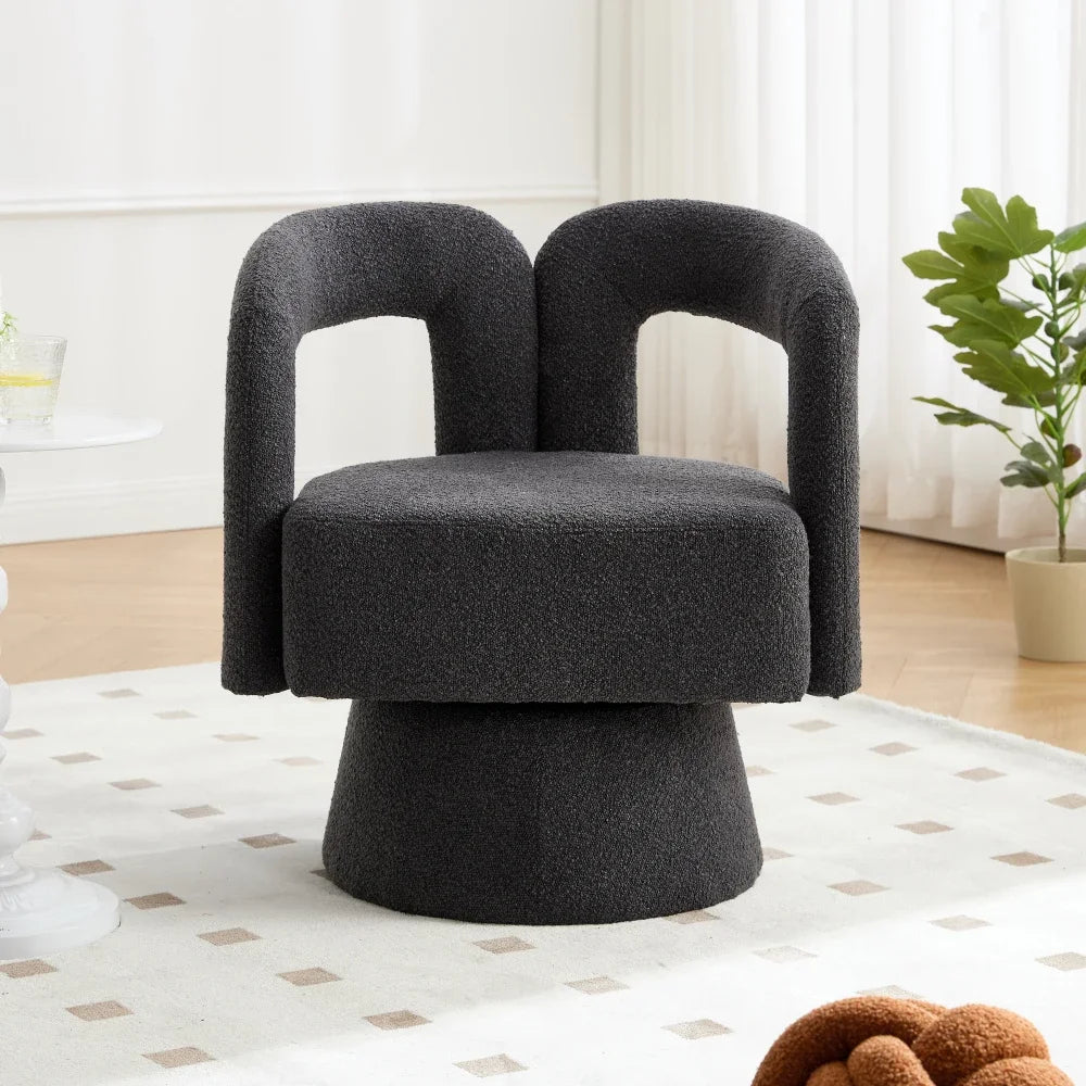 Fauteuil rond pivotant en tissu bouclé, gris foncé, dans un salon